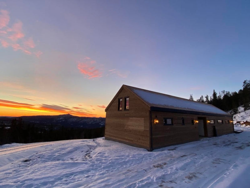 Modern timber frame panel private house in Latvia with a courtyard sunset view