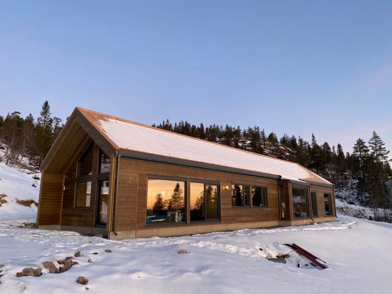 Modern timber private house in Scandinavian design with large panoramic windows